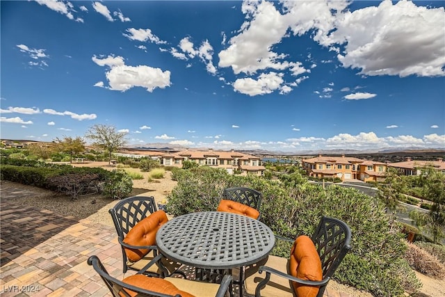 view of patio with a residential view and outdoor dining area