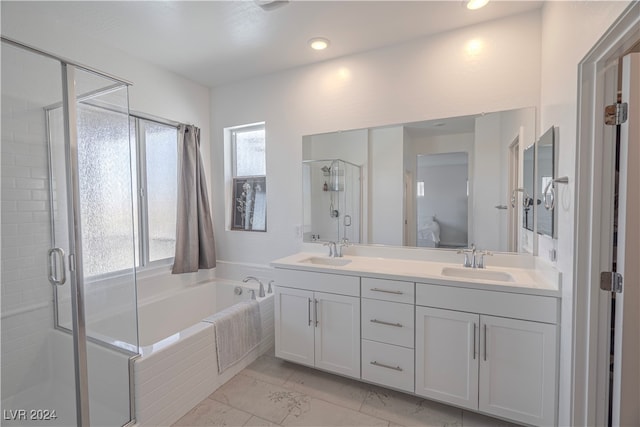 bathroom with separate shower and tub and vanity