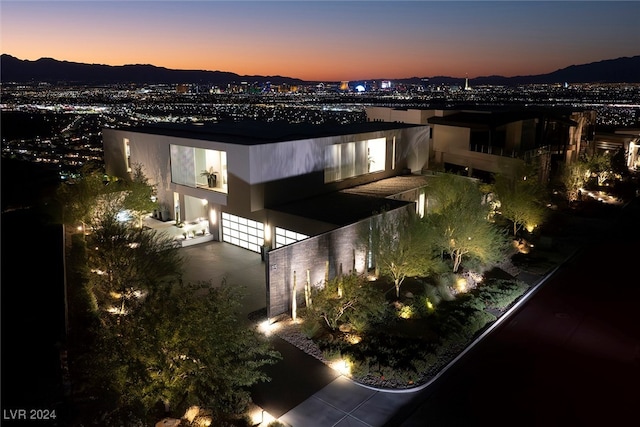 exterior space with a mountain view and a balcony