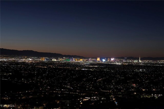 property's view of city featuring a mountain view