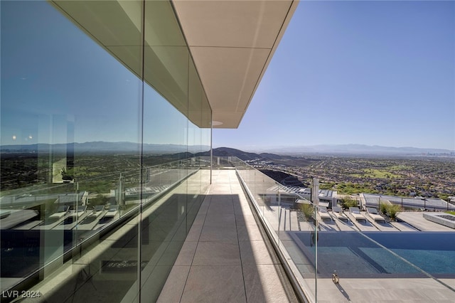 balcony featuring a mountain view