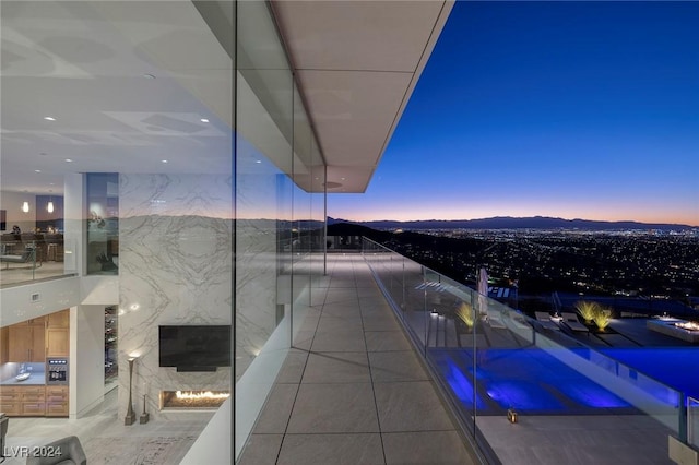 view of balcony at dusk