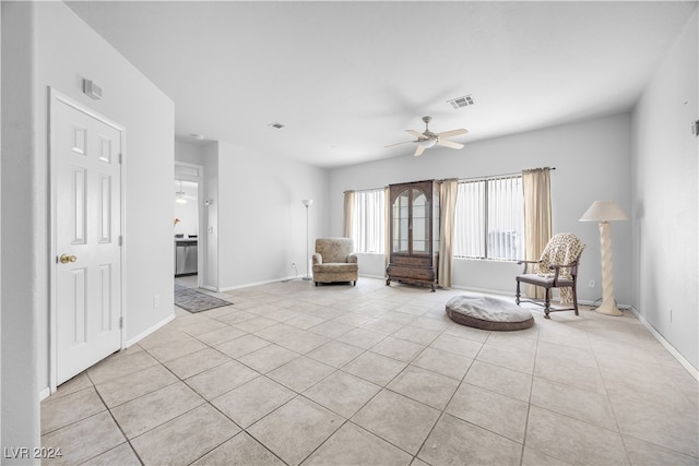 unfurnished room featuring ceiling fan and light tile patterned flooring