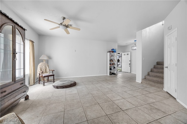 unfurnished room featuring light tile patterned floors and ceiling fan