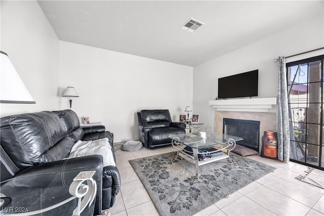 tiled living room with a high end fireplace