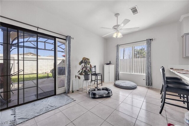 interior space featuring ceiling fan and light tile patterned floors