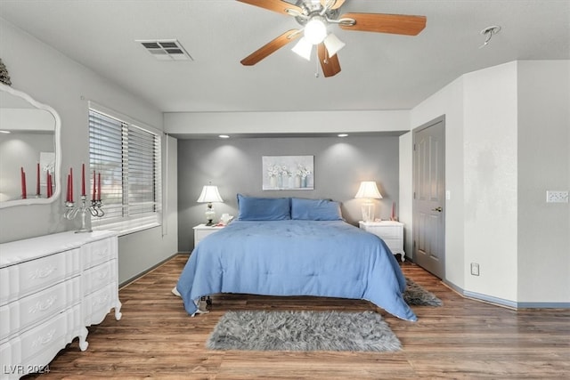 bedroom featuring ceiling fan and dark hardwood / wood-style flooring