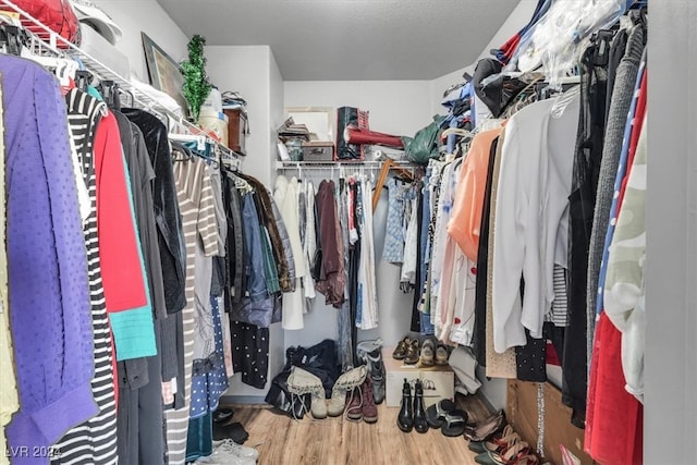 walk in closet featuring light wood-type flooring