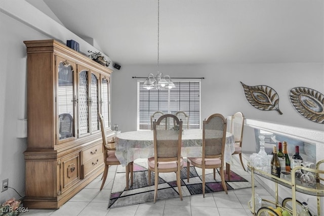 dining area with light tile patterned floors and a notable chandelier