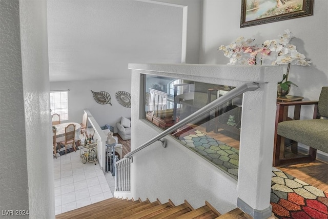 staircase with tile patterned floors