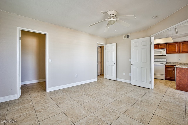 interior space featuring ceiling fan and light tile patterned floors