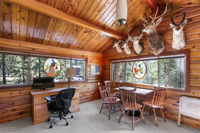 carpeted office with wood ceiling, a wealth of natural light, rustic walls, and lofted ceiling with beams