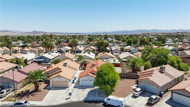 birds eye view of property with a mountain view