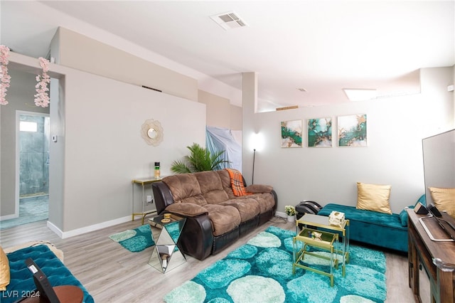 living room with light hardwood / wood-style floors