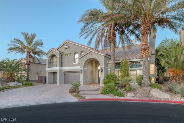 mediterranean / spanish house with a garage