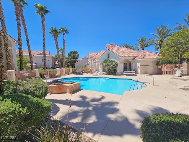 view of swimming pool featuring a patio area