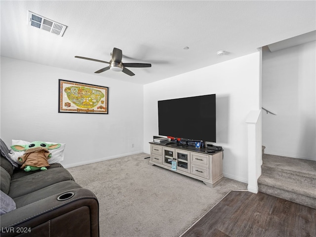 living room with ceiling fan and light carpet