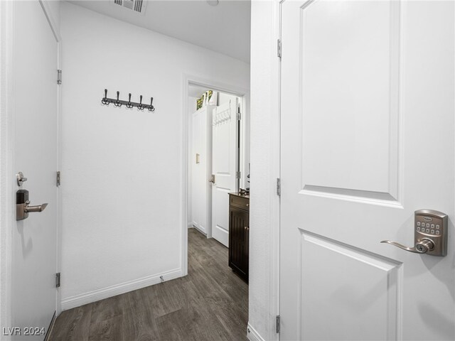 hallway with dark wood-type flooring