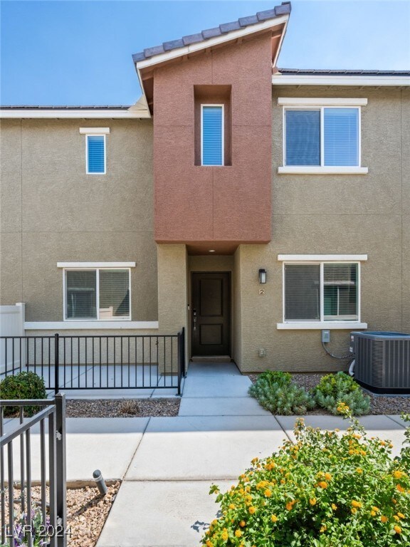 view of front of property with central air condition unit