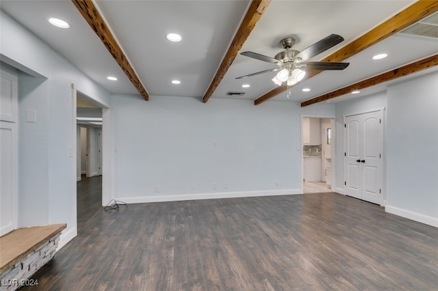 unfurnished living room with dark hardwood / wood-style flooring, ceiling fan, and beam ceiling