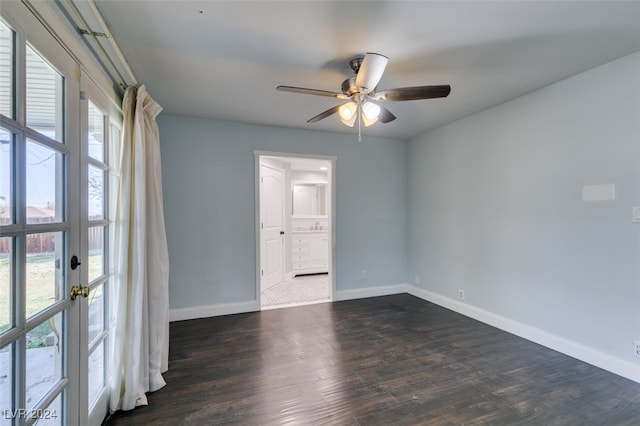 unfurnished room with dark wood-type flooring and ceiling fan