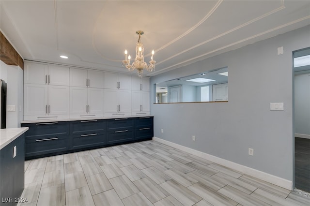 interior space featuring an inviting chandelier and light hardwood / wood-style flooring