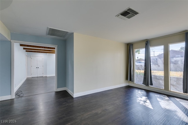 unfurnished room featuring dark hardwood / wood-style floors