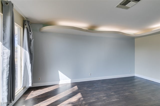 empty room with dark wood-type flooring