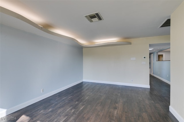 empty room featuring dark hardwood / wood-style floors