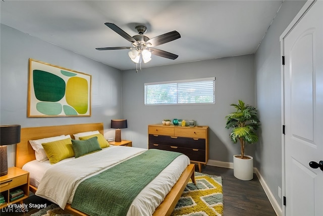 bedroom with dark wood-type flooring and ceiling fan