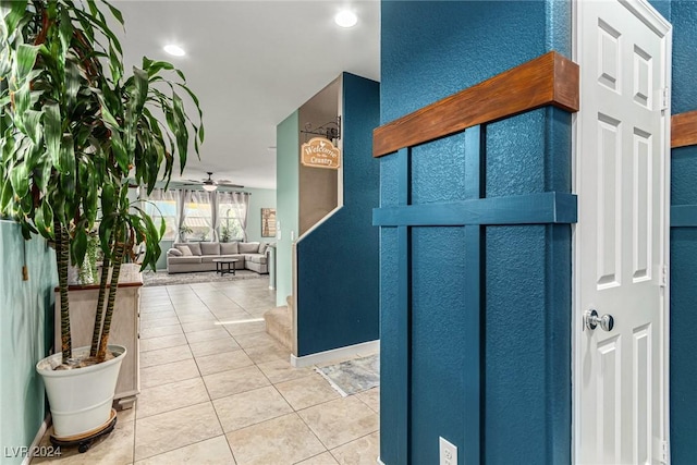 hallway with tile patterned flooring