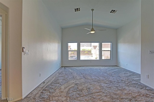 empty room with carpet flooring, ceiling fan, and vaulted ceiling