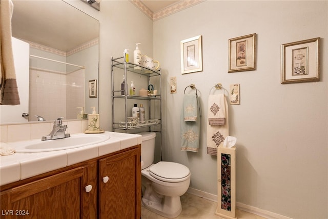 bathroom featuring tile patterned flooring, vanity, toilet, and walk in shower