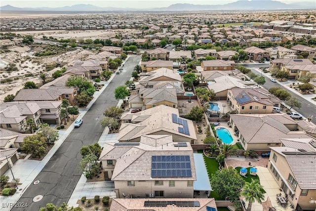 birds eye view of property with a mountain view