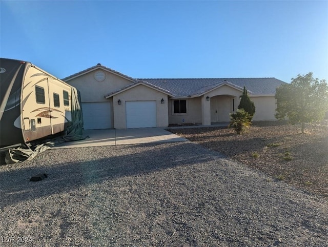 ranch-style home with a garage