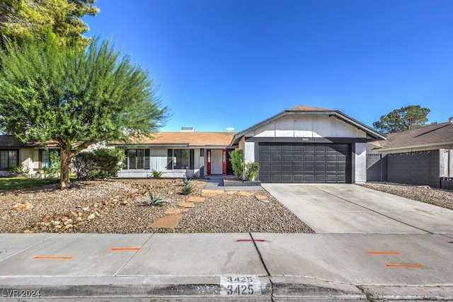 ranch-style home featuring a garage