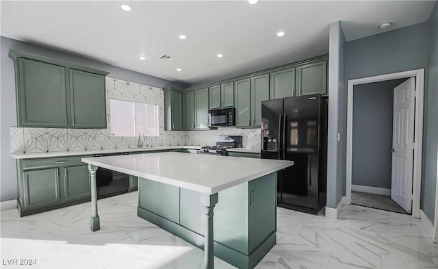 kitchen with green cabinetry, black appliances, a breakfast bar area, a kitchen island, and tasteful backsplash