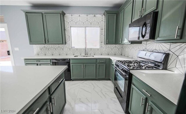 kitchen with black appliances and green cabinets