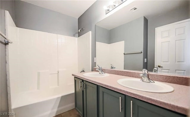 bathroom featuring vanity and shower / bathtub combination