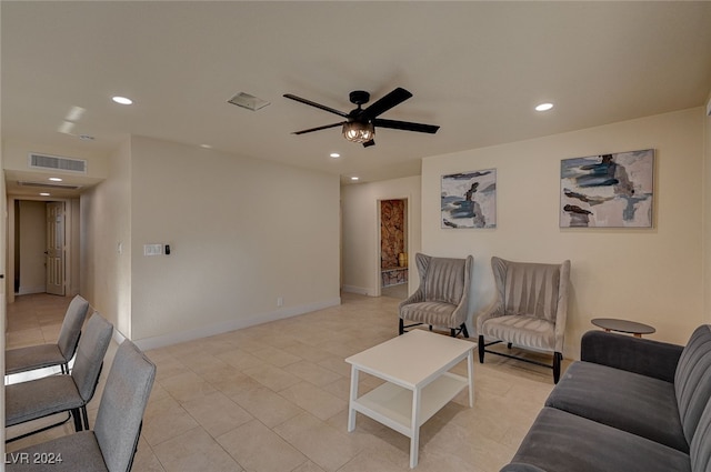 tiled living room with ceiling fan