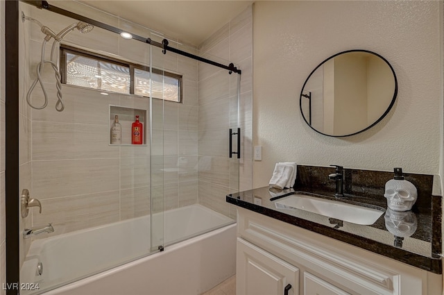 bathroom featuring vanity and shower / bath combination with glass door