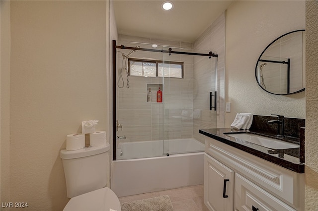 full bathroom with shower / bath combination with glass door, vanity, toilet, and tile patterned flooring