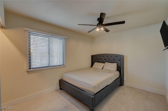 4729 Bennett Dr, Las Vegas, NV 89121 - bedroom with tile patterned floors, baseboards, and ceiling fan