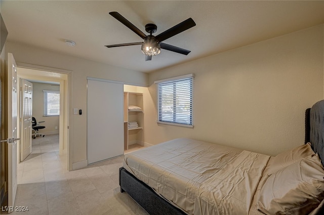 bedroom featuring ceiling fan and light tile patterned floors