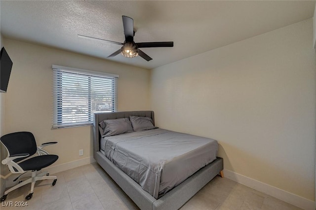 4729 Bennett Dr, Las Vegas, NV 89121 - bedroom with light tile patterned floors, baseboards, and a ceiling fan