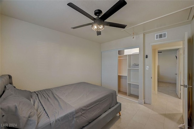 4729 Bennett Dr, Las Vegas, NV 89121 - bedroom with visible vents, a ceiling fan, attic access, and light tile patterned flooring