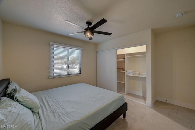 4729 Bennett Dr, Las Vegas, NV 89121 - bedroom featuring a closet, baseboards, a ceiling fan, a textured ceiling, and light tile patterned flooring