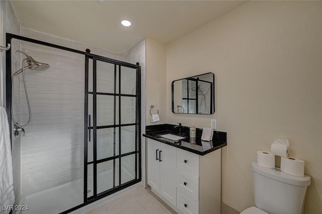4729 Bennett Dr, Las Vegas, NV 89121 - bathroom with tiled shower, vanity, toilet, and tile patterned flooring