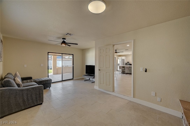 living room featuring ceiling fan