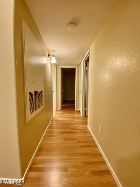 hallway with light wood-type flooring